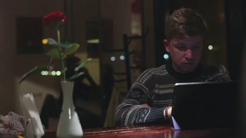 Man using tablet computer touchscreen on wooden table in cafe 1080p video Stock Footage 76563253