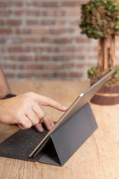 Man using a tablet computer to work Stock Photos