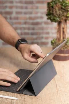 Man using a tablet computer to work Stock Photos