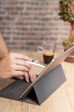 Man using a tablet computer to work Stock Photos