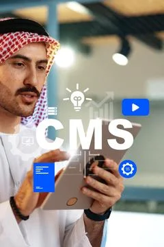 Man using tablet for content management system tasks in modern office setting Stock Photos