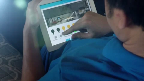 A man is using a tablet to control Home with Smarthome Video stock 314455355