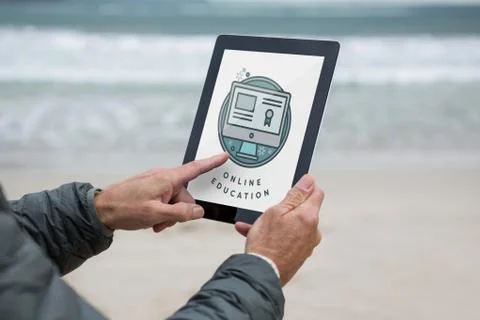Man using a tablet with e-learning information in the screen Stock Photos