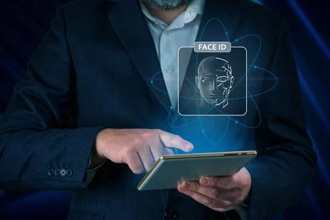 Man using tablet with face id scan and modern technology. Login using Face id Stockfoto's