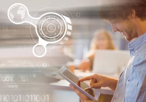 Man using tablet with graph overlays 写真素材