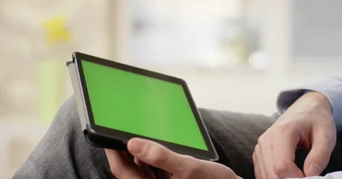 Man using Tablet with Green Screen Stock Footage 85328656