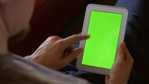 Man Using Tablet Green Screen 01 4K Stock Footage 86925310