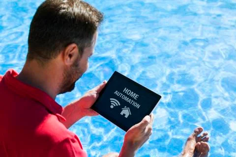 Man using tablet for home automation. Stock Photos