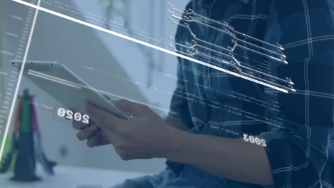 A man is using a tablet at home to process financial data Stock Footage 326038795
