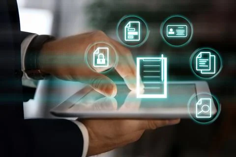 Man using tablet indoors and documents icons, closeup Foto stock