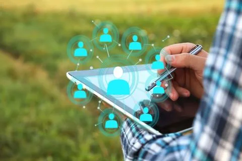 A man using a tablet to manage his workforce. The photo, a powerful symbol .. Stock Photos