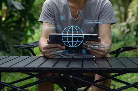 Man Using Tablet with Network Security Concepts in Outdoor Setting Stock Photos