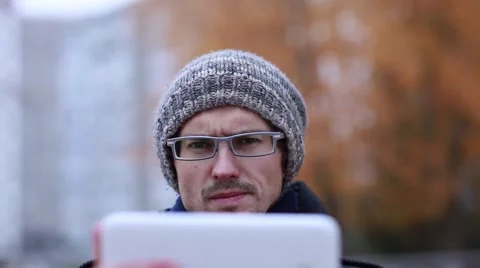 Man Using Tablet Outdoors Stock Footage 56639769