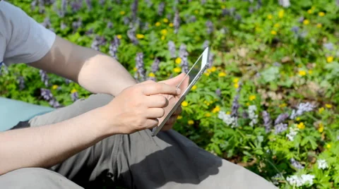 Man using tablet outdoors. Stock Footage 63061799