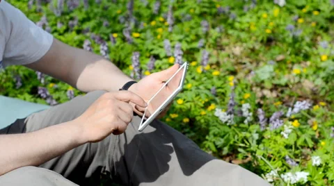 Man using tablet outdoors. Stock Footage 63063107