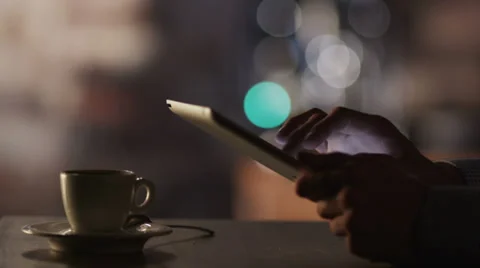 Man Using Tablet PC and Drinking Coffee in Cafe 4K Stock Footage 27822782