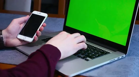 Man is using tablet pc and mobile phone. Close up. Green screen. Stock Footage 61281658