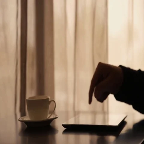 Man Using Tablet PC and Drinking Coffee in Cafe Stock Footage 69577077