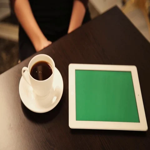Man Using Tablet PC and Drinking Coffee in Cafe Stock Footage 69577926