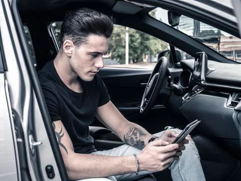 Man using tablet PC in car Stock Photos