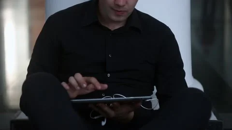 Man is using tablet PC Stock Footage 54267339