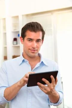 Man using tablet pc indoor Stock Photos