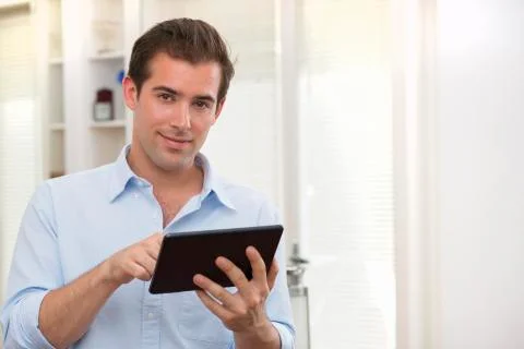 Man using tablet pc indoor Stock Photos