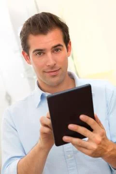 Man using tablet pc indoor Stock Photos