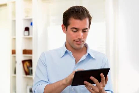 Man using tablet pc indoor Stock Photos