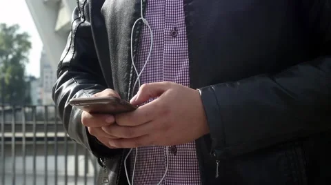 Man is using tablet PC on the street Stock Footage 55534801