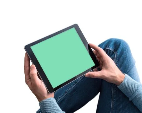 Man using tablet pc while sitting on a floor. Clipping path for display 스톡 사진