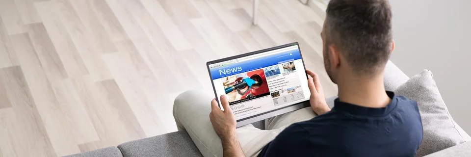 Man Using Tablet Reading Electronic News Stock Photos