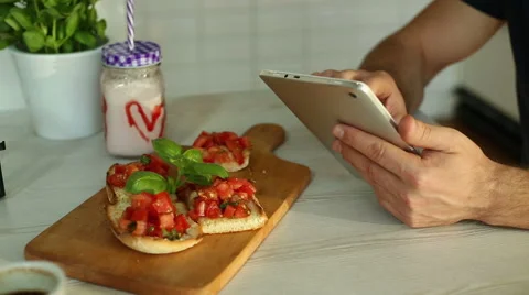 Man using tablet in restaurant, closeup Stock Footage 67994890