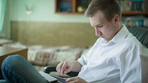Man Is Using A Tablet To Rewrite In Social Networks Stock Footage 36197187