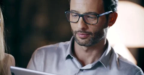 Man using tablet technology.Corporate business team work office meeting.Three Stock Footage 78060605