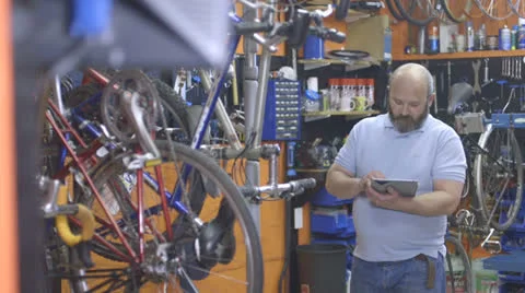 Man using tablet in workshop Stock Footage 24363225