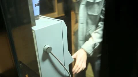Man Using Telephone Box at Night Stock Footage 10685270
