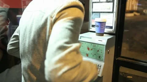 Man Using Telephone Box at Night In Street Stock Footage 10685889