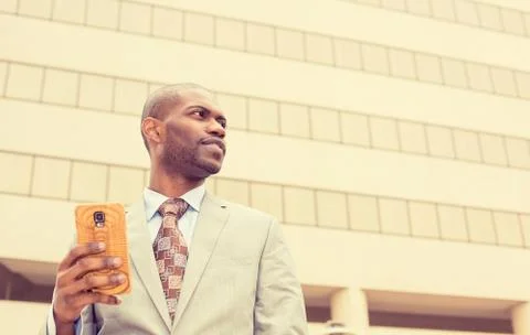 Man using texting on smart phone reading news Stock Photos