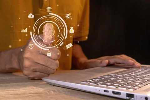 Man using thumb to scan fingerprint on virtual screen to access internet ba.. Stock Photos
