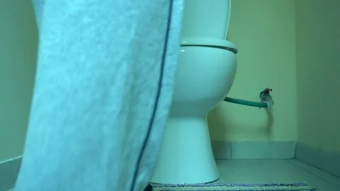 Man using toilet, taking off trousers Stock Footage 72108968