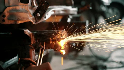 Man using tool for cutting front steel chassis of car with gas torch Stock Footage 140713984