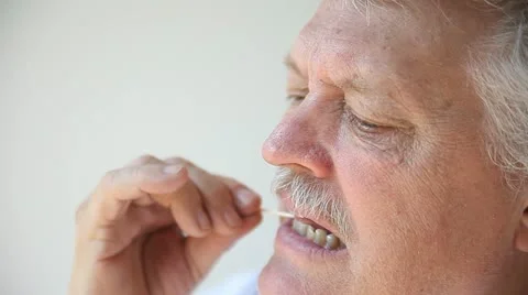 Man using toothpick Stock Footage 11802968