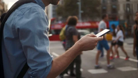 Man using touch Mobile Phone outdoor, close up, man walking with cell phone on Stock-Footage 116187675