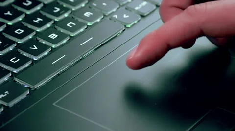 Man using touchpad on notebook keyboard Stock Footage 63547372