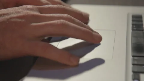 Man using the trackpad of his MacBook. Stock-Footage 136310524