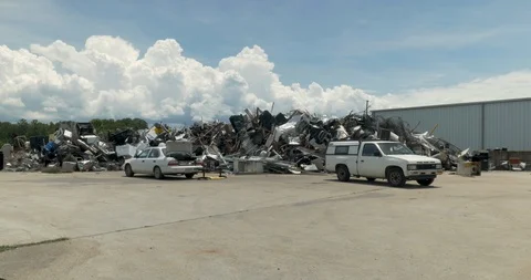 Man using two cars to throw away his trash and household waste Stock Footage 89343996