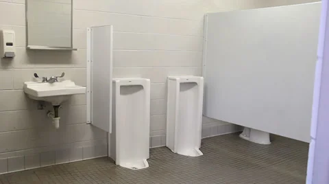 Man using a urinal Stock Footage 39459256