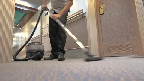 Man using vacuum cleaner Stock Footage 146101214