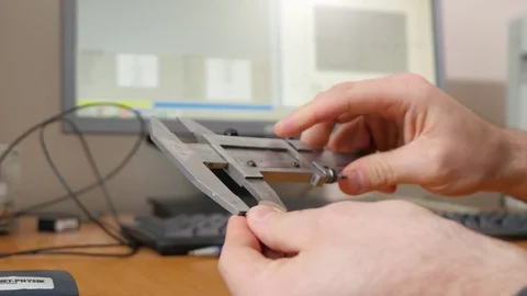 Man using vernier caliper. Man uses steelconsult to measure Stock Footage